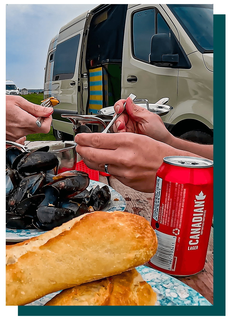 Eating mussels in front of our DIY Sprinter campervan by the ocean in Prince Edward Island
